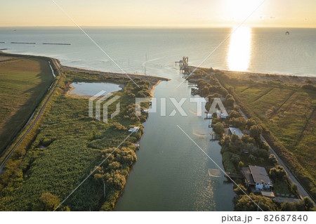 Awesome drone shot of fishing huts in adriatic coast Awesome drone shot of fishing huts in adriatic coast 82687840
