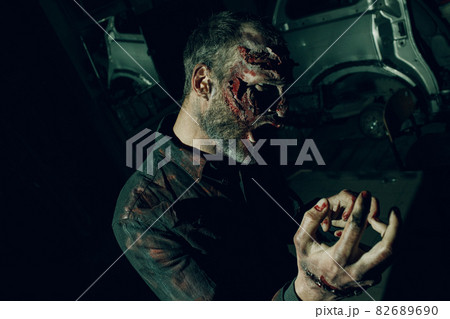 Zombie male makeup for halloween concept. Blood on skin face 82689690