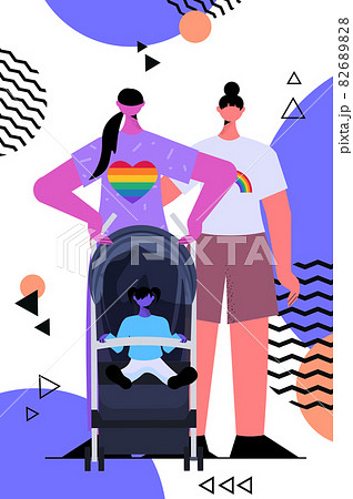 lesbian family walking with newborn baby in stroller motherhood transgender love LGBT community lesbian family walking with newborn baby in stroller motherhood transgender love LGBT community 82689828