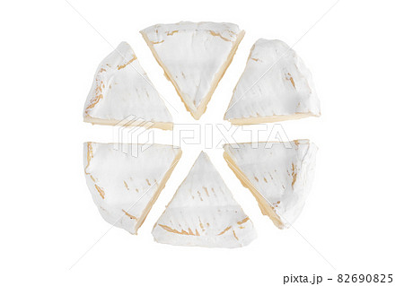 Camembert on a white background. Camembert cheese close-up on a white background. 82690825