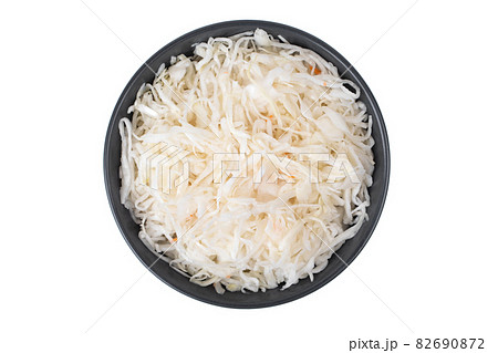 Sauerkraut on a white background. Pickled cabbage close-up in a plate on a white background. Sauerkraut on a white background. Pickled cabbage close-up in a plate on a white background. 82690872