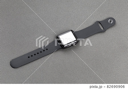 Smart watch with a blank white screen on a gray background. 82690906