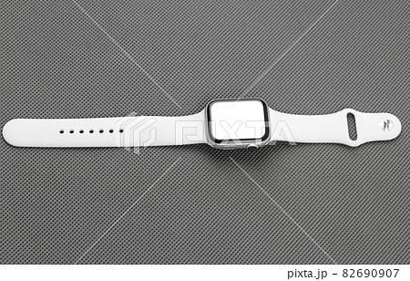 Smart watch with a blank white screen on a gray background. 82690907