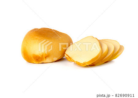 Cheese on a white background. Smoked cheese close-up on a white background. Cheese on a white background. Smoked cheese close-up on a white background. 82690911