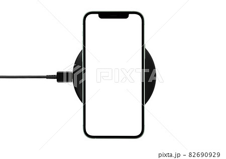 Smartphone with blank screen on wireless charging isolated on white background. Smartphone with blank screen on wireless charging isolated on white background. 82690929