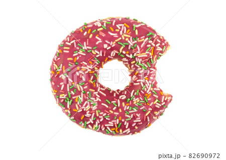 Donut close-up on a white background. Bitten donut isolated on white background. Donut close-up on a white background. Bitten donut isolated on white background. 82690972