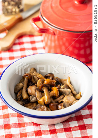 Sliced preserved mushrooms in bowl. Sliced preserved mushrooms in bowl. 82691931