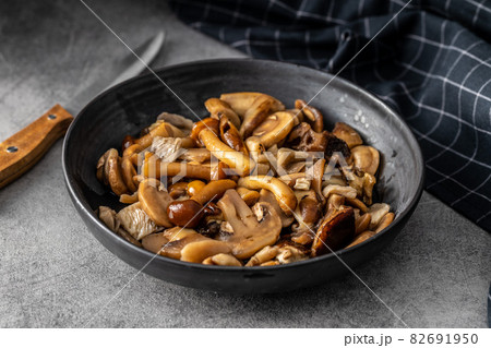 Sliced preserved mushrooms in bowl. Sliced preserved mushrooms in bowl. 82691950
