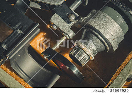 Old Soviet photo enlarger. Kit for developing film photography. Dust on the details, horizontal composition, vintage Old Soviet photo enlarger. Kit for developing film photography. Dust on the details, horizontal composition, vintage 82697929