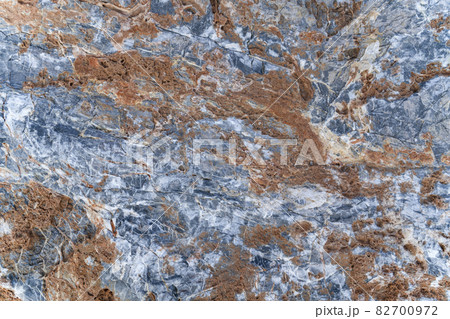 Background texture of stone slab with gray-orange pattern. Layer of rust on surface of stone. 82700972