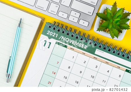 November 2021 desk calendar and diary with keyboard computer. 82701432