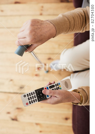 Senior Woman Watching Tv in Retirement Home 82704380