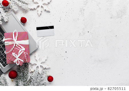 Christmas and New Year flat lay with laptop computer, credit card, gift boxes 82705511