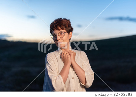Portrait at dusk of a non-binary gender woman 82705592