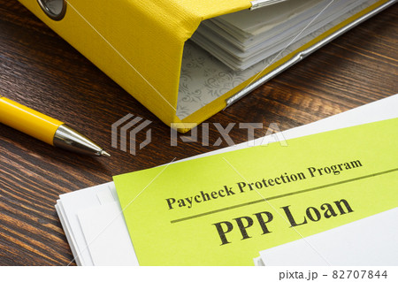 Paycheck Protection Program or PPP loan papers and yellow folder. Paycheck Protection Program or PPP loan papers and yellow folder. 82707844