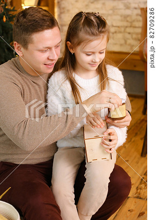 Dad and daughter enjoy peanut or almond butter, peanut butter sandwich 82709286