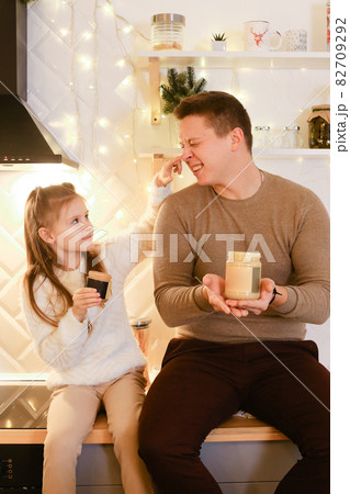 Dad and daughter enjoy peanut or almond butter, peanut butter sandwich 82709292