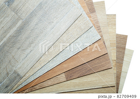 Vinyl and linoleum samples on a white isolated background. Vinyl for flooring with wood grain texture and pattern. 82709409