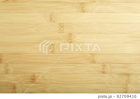 Bamboo background. Treated bamboo wood surface for countertops, furniture and tableware. 82709410