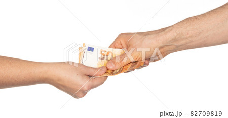 Male and female hand giving and receiving euro's Male and female hand giving and receiving euro's 82709819