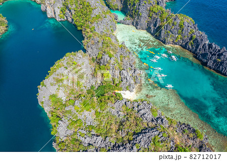 Aerial drone view azure sea and of tourist boats around the beautiful big and small lagoons in El Aerial drone view azure sea and of tourist boats around the beautiful big and small lagoons in El 82712017