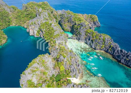 Aerial drone view azure sea and of tourist boats around the beautiful big and small lagoons in El Aerial drone view azure sea and of tourist boats around the beautiful big and small lagoons in El 82712019