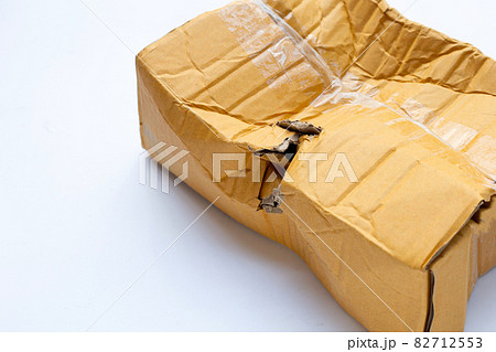 Damaged cardboard box with hole Damaged cardboard box with hole 82712553