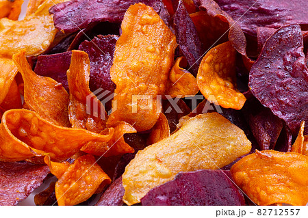 Purple and yellow sweet potato chips Purple and yellow sweet potato chips 82712557