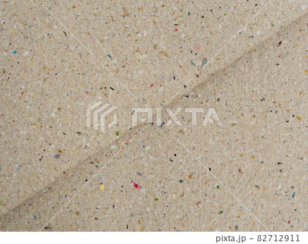 Recycle cardboard paper / brown colored background Recycle cardboard paper / brown colored background 82712911