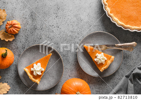 American Pumpkin Pie served for two person for Thanksgiving Day. American Pumpkin Pie served for two person for Thanksgiving Day. 82713810