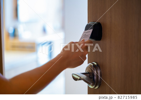 Hand Holding Key card Hotel for access the room 82715985