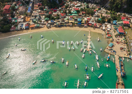 Aerial top view on the village of El Nido with many fisherman boats in Palawan Island, Philippines. Aerial top view on the village of El Nido with many fisherman boats in Palawan Island, Philippines. 82717501