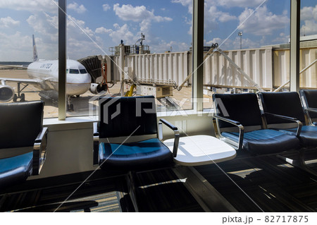 View of departure area waiting chairs airplanes from United Airlines the George Bush Intercontinental Airport IAH in Houston, Texas, United States. 82717875