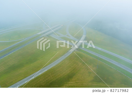 A dense fog in the early morning around the bridge across US 65 Highway near Satsuma, Alabama A dense fog in the early morning around the bridge across US 65 Highway near Satsuma, Alabama 82717982