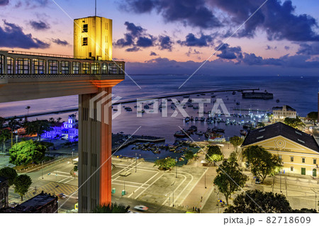 Lacerda elevator illuminated at dusk and with the sea and boats in the background Lacerda elevator illuminated at dusk and with the sea and boats in the background 82718609