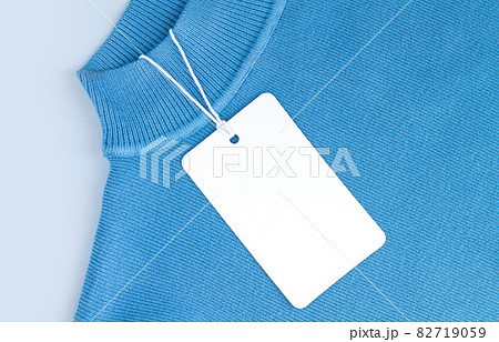 Mock-up of blank paper price tag or label on jersey background Mock-up of blank paper price tag or label on jersey background 82719059