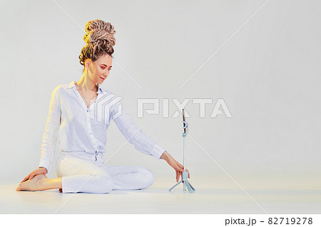 Woman tells story online using mobile phone on tripod Woman tells story online using mobile phone on tripod 82719278