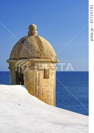 Stone guardhouse on the walls of an old and historical colonial-style fort 82720781