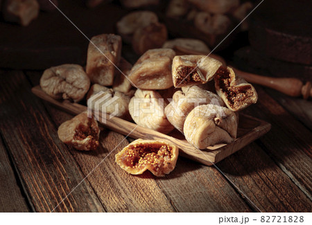 Dried figs on a old wooden table. Dried figs on a old wooden table. 82721828