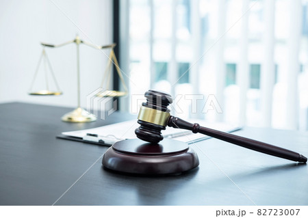 Judge gavel with Justice at law firm in background with legal case document contract, law and justice, attorney, lawsuit Judge gavel with Justice at law firm in background with legal case document contract, law and justice, attorney, lawsuit 82723007