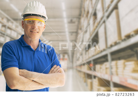 Warehouse inventory store staff worker man employee smart standing smile with space for text. 82723263