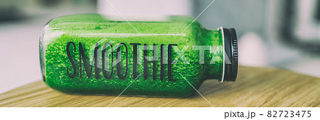 Green smoothie healthy eating drink detox celery juice diet bottle with text title SMOOTHIE for to go breakfast beverage panoramic banner. Green smoothie healthy eating drink detox celery juice diet bottle with text title SMOOTHIE for to go breakfast beverage panoramic banner. 82723475