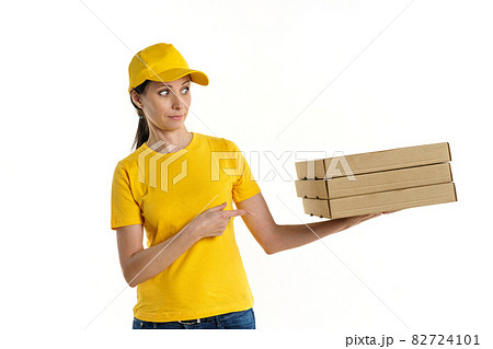 Woman delivery woman in yellow uniform on white background Woman delivery woman in yellow uniform on white background 82724101