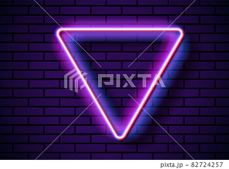 Neon frame with triangle shape on the blue brick wall. Classic rectangular 80s styled purple shiny glowing neon sign. Neon frame with triangle shape on the blue brick wall. Classic rectangular 80s styled purple shiny glowing neon sign. 82724257