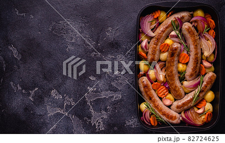 Fried sausages with vegetables. Fried sausages with vegetables. 82724625