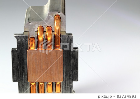 A close up view of CPU Heatsink with copper heat pipe isolated on white background. A close up view of CPU Heatsink with copper heat pipe isolated on white background. 82724893
