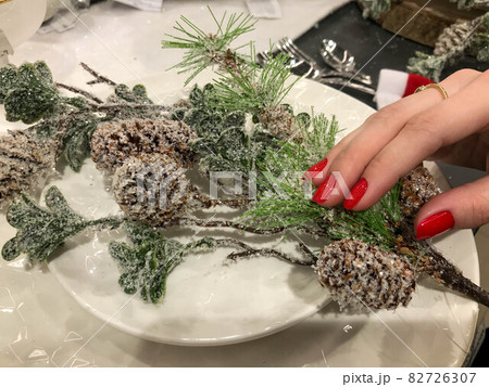 Christmas Table Setting. Spruce branch with Cranberry Dusted with Snow. Holidays Background. Decorations Christmas Table Setting. Spruce branch with Cranberry Dusted with Snow. Holidays Background. Decorations 82726307