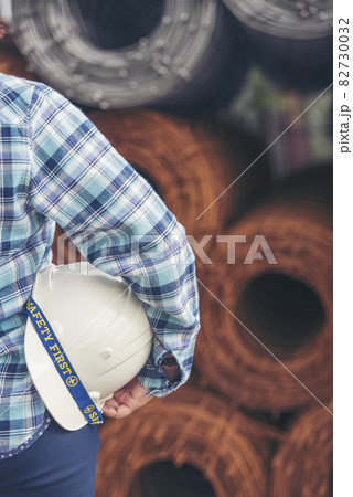 Woman construction engineer wear safety white hard hat at construction site industry worker. Female engineer worker civil engineering with hard hat safety helmet. Woman construction Engineer concept 82730032