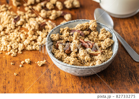 Sweet granola cereals in bowl. 82733275