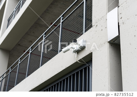 Security cameras on modern building. Professional surveillance camera. CCTV on the wall with LED IR lights. Security system, technology concept. Video equipment for safety system area control outdoor. Security cameras on modern building. Professional surveillance camera. CCTV on the wall with LED IR lights. Security system, technology concept. Video equipment for safety system area control outdoor. 82735512